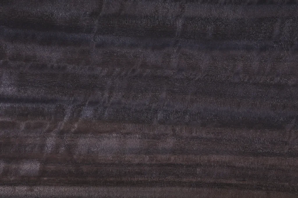 Fumed figured eucalyptus wood veneer quarter cut with rich movement and deep tonal variation