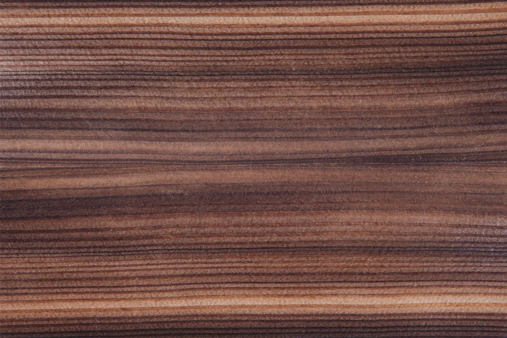 Fumed larch veneer quarter cut with contrasting bands in dark brown and honey tones
