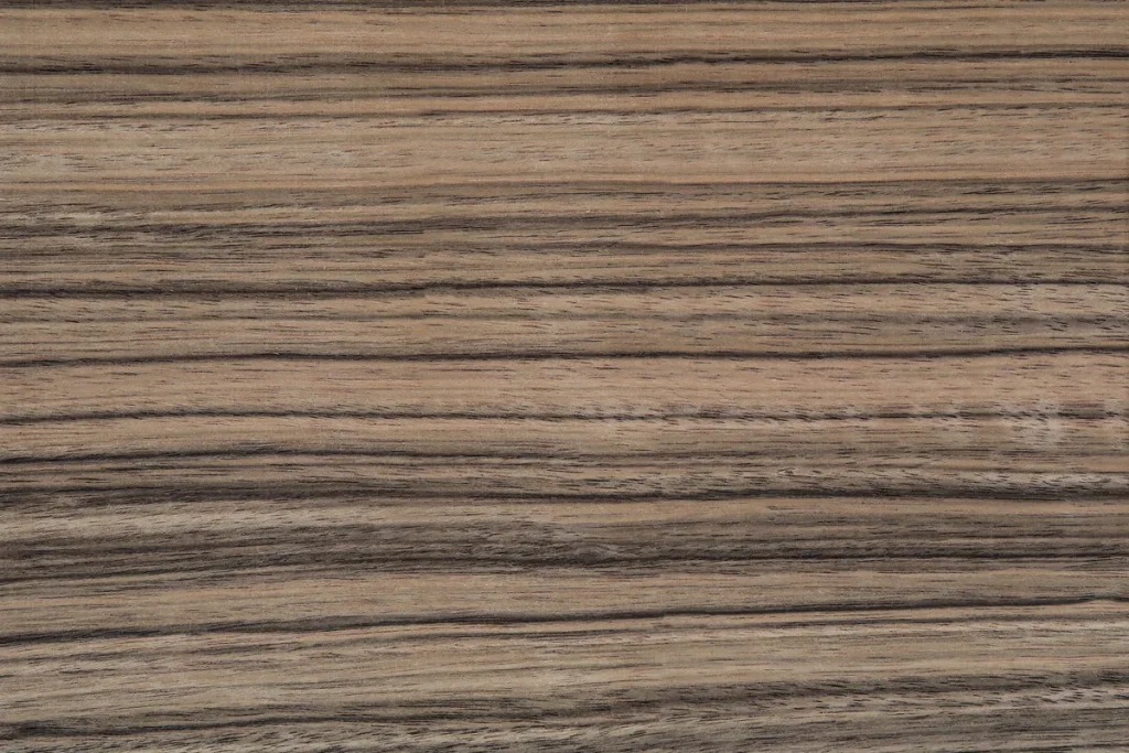 Paldao wood veneer quarter cut, featuring strong straight grain with brown and beige linear contrast