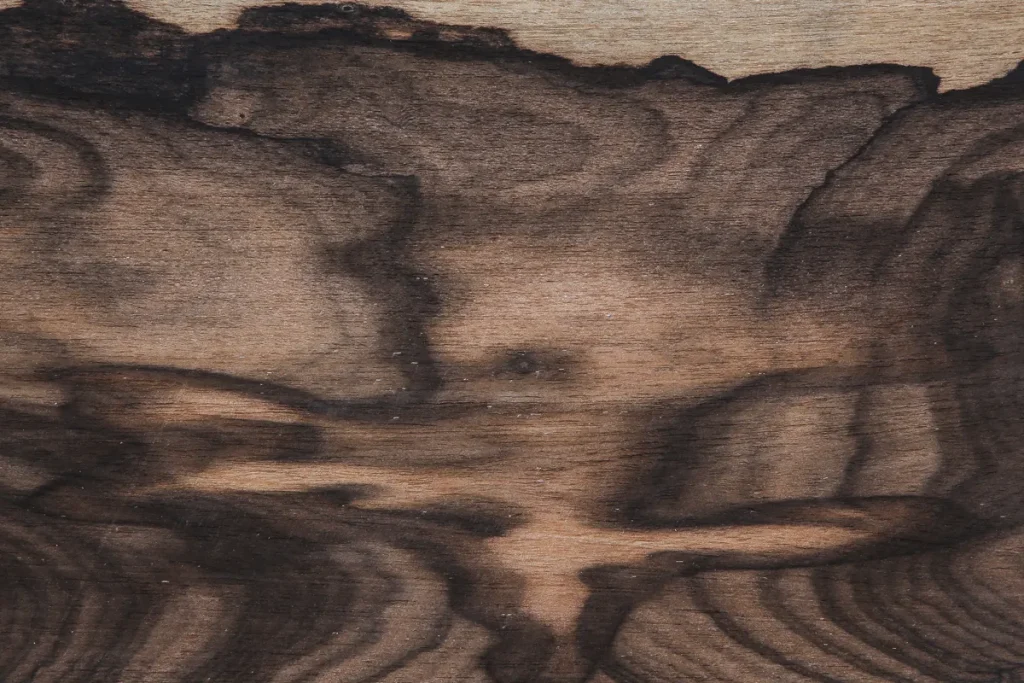 Flat cut Ziricote wood veneer with irregular grain, strong contrast and dynamic visual effect