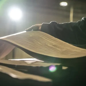 Walnut wood veneer being manipulated